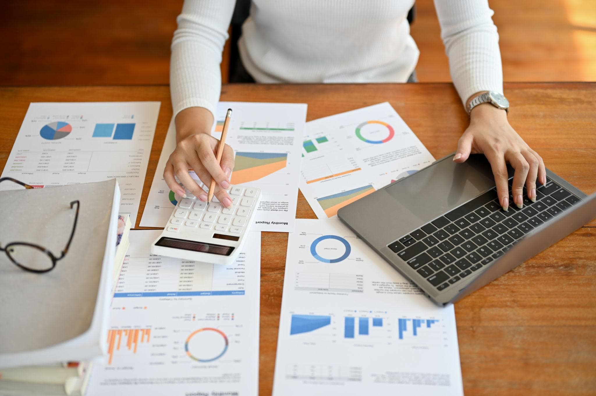 Financial documents and calculator on a professional desk